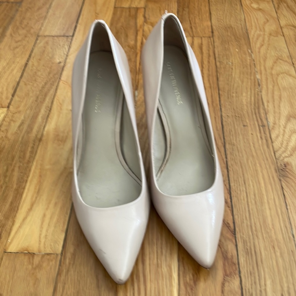 Nude pink pumps from Saks